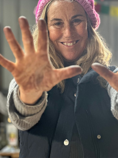 Adrienne Quenby with painted hands